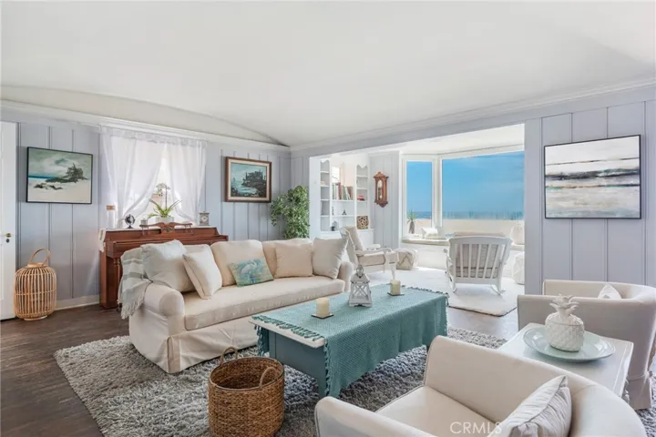 Bright coastal living room with an open layout and ocean views. Light-filled space with a relaxed beachside feel, perfect for entertaining or unwinding.