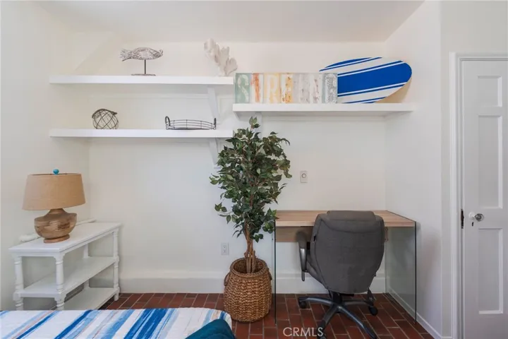Quiet workspace tucked away for privacy, featuring a dedicated desk—perfect for working remotely or catching up while enjoying your beach stay.