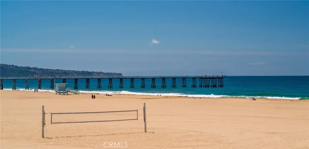 Enjoy beachside living with volleyball courts just steps away and easy access to the Hermosa Pier for a scenic stroll.