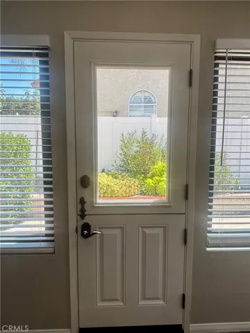 Dutch door leads to low maintenance backyard