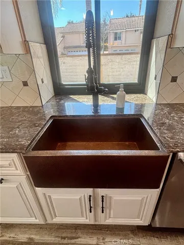 Hammered copper farm house style sink with upgraded faucet.