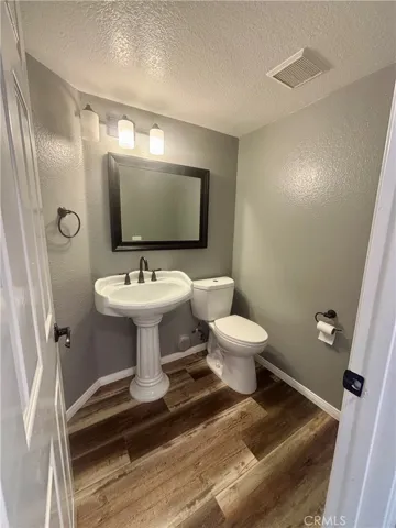 Bathroom #1: Convenient powder room located downstairs.
