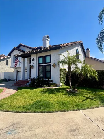 Great curb appeal with front lawn, corner location offers privacy.