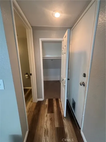 hall to 1/2 bath, walk in closet and access to 2 car garage