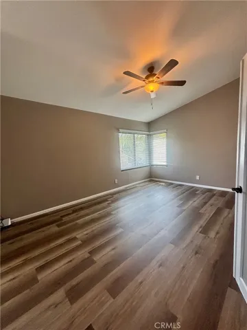 Primary suite is spacious with ceiling fan