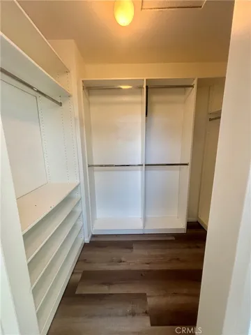 Walk-in closet with built-in shelves