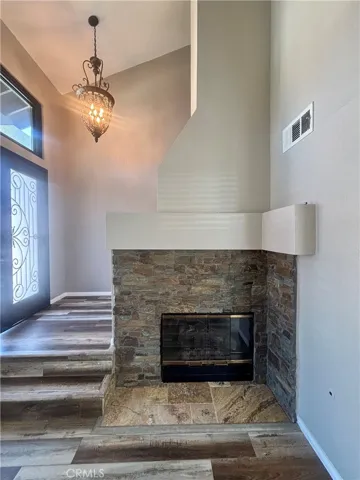 Fireplace with stone and ledger stacked stone fireplace with gas starter.