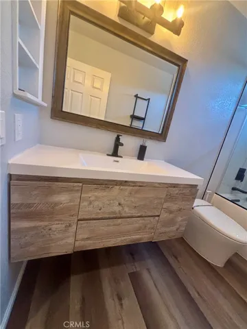 Smart toilet, new fixtures and custom mirror