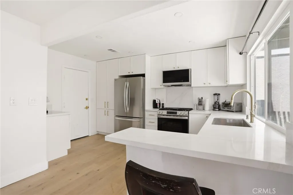 Beautiful Kitchen with White Quartz Countertops