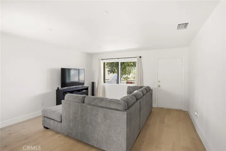 Front Entry and Living Room with Plenty of Natural Light