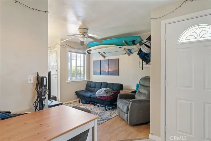 Living room leading to the balcony/ Dining area