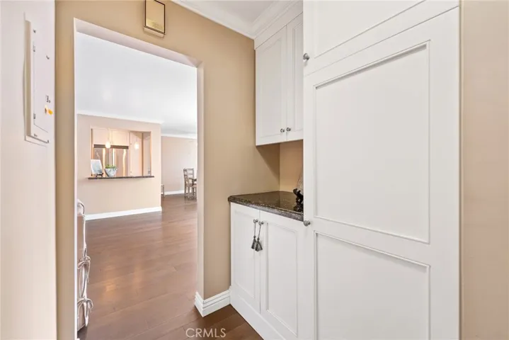 Possible location for laundry...taller cabinet is water heater