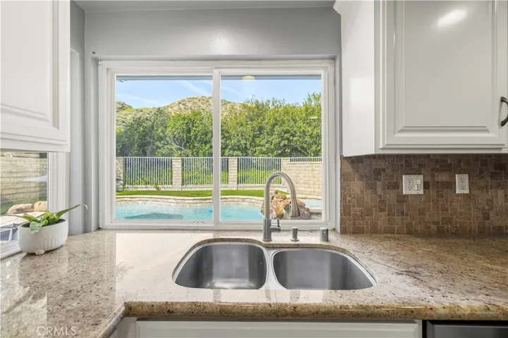 Kitchen sink overlooking backyard