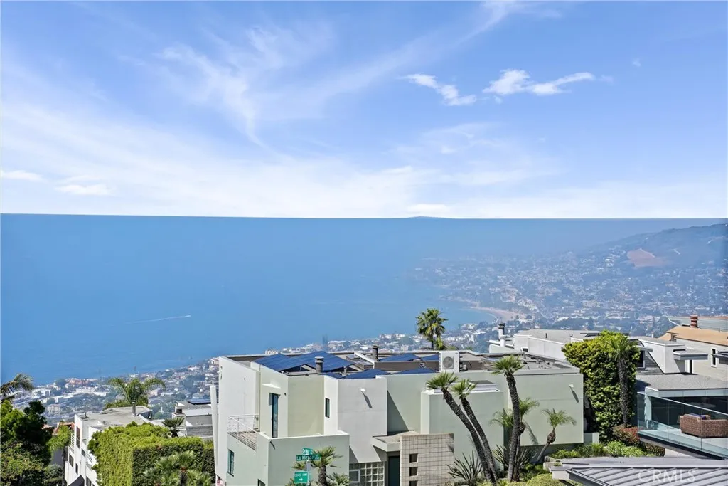 Coastal living with ocean views and beach-close convenience, while offering a more private setting away from the busy downtown area