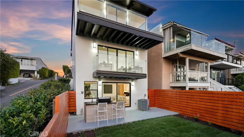 Private exterior area featuring a custom-designed BBQ, new landscape, and inviting entertaining space.