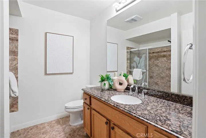Granite countertops and bathtub and shower