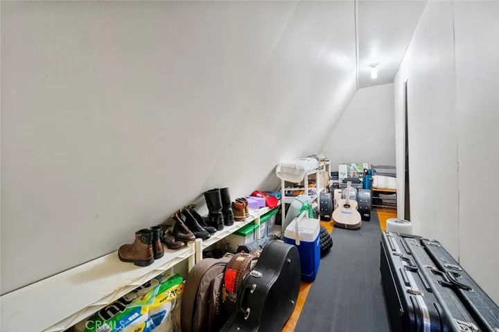 Large L-shaped walk in closet. Wall to the right is the half bath upstairs.