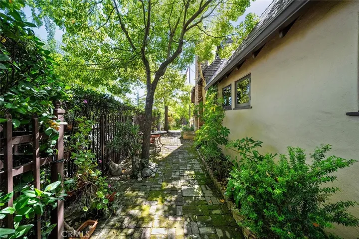 Standing from side gate of side yard facing toward the front yard.