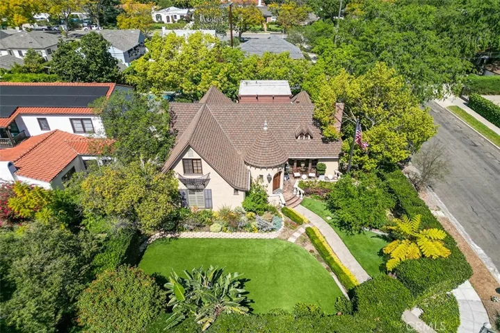 Beauty all around in this home offering storybook and whimsical charm on the corner of Orange Grove and Martelo.