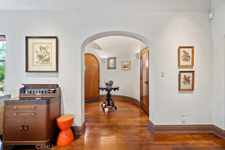 Standing in living room facing the formal entry with wine cellar.