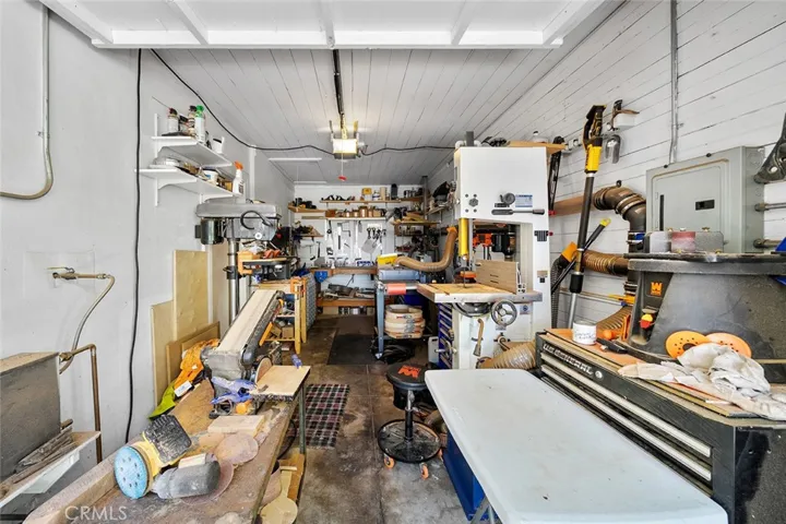 One side of the garage currently used as a workspace.