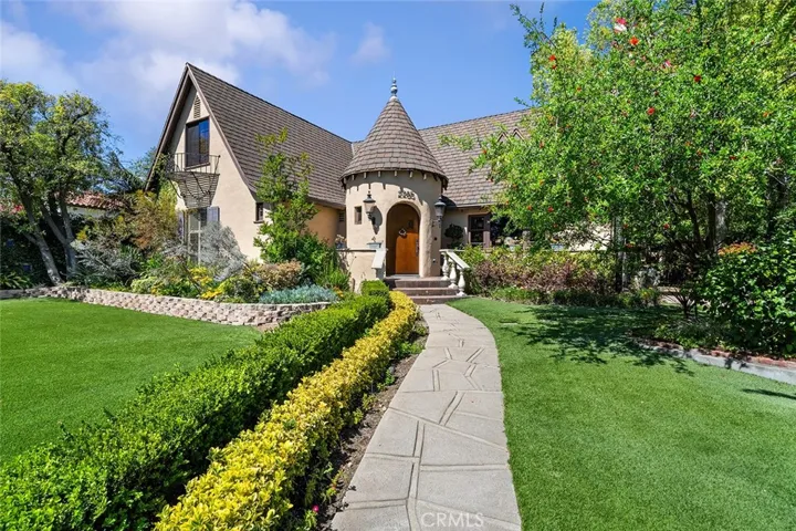 Lovely landscaped yard and a pathway to the front door.