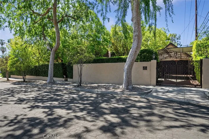Looking towards the driveway and side yard on the street of Martelo. Orange Grove will be to the left.