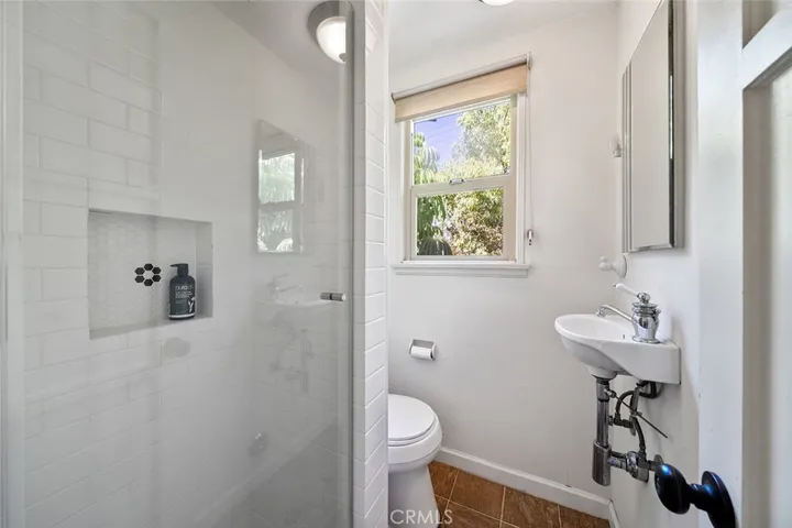 Apartment 3/4 bathroom. Window faces backyard.