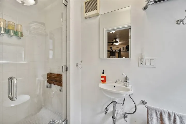3/4 bathroom in converted garage that has the gym.
