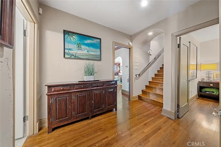 An open landing set among the two bedrooms, lower level 3/4 bathroom and stairs lead to the upstairs bedroom with half bath. Throughway near the stairs leads to the dining and living area.
