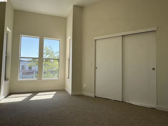 Unfurnished bedroom featuring carpet floors and a closet