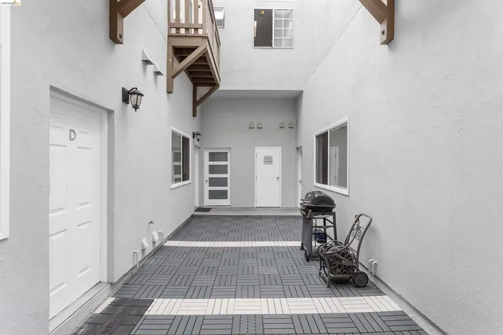View of exterior entry featuring stucco siding