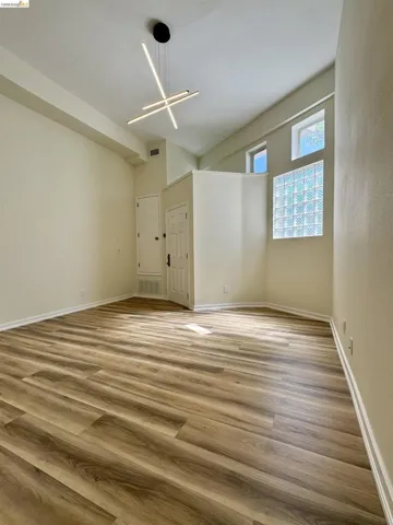 Spare room with wood finished floors and baseboards