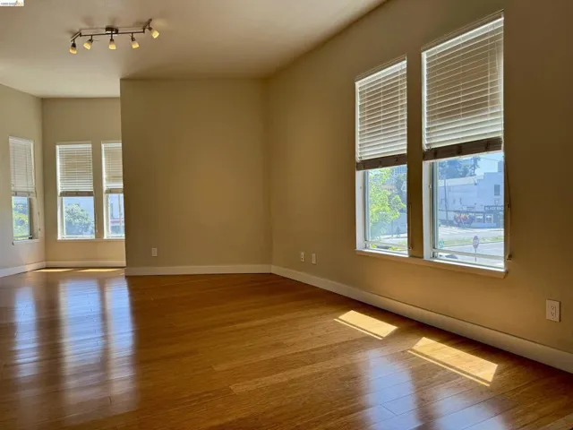 Empty room featuring wood finished floors and baseboards
