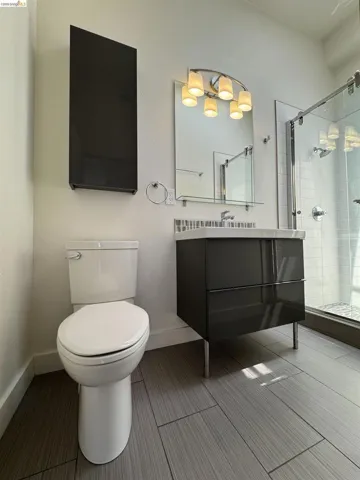 Full bathroom featuring a shower stall and vanity