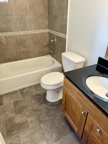 Full bathroom with vanity and shower / tub combination