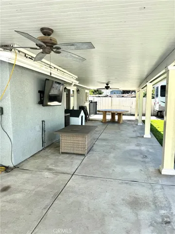 Side to side roofed patio.