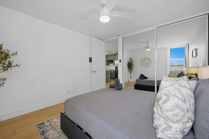 Spacious bedroom with dual pane windows, ceiling fan & custom built in closet!