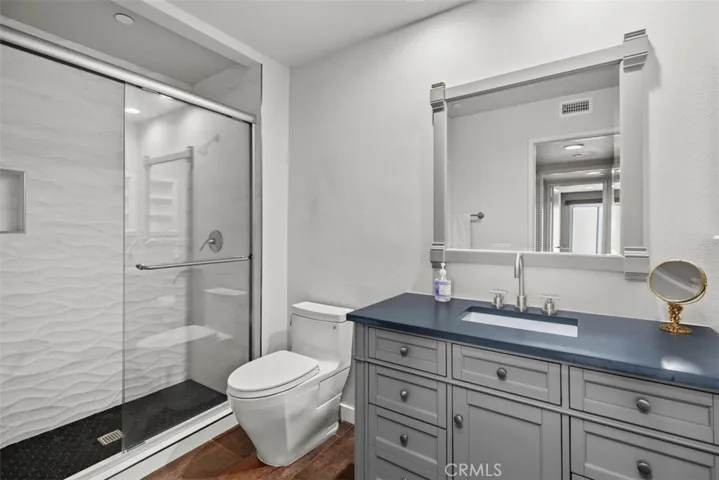 Remodeled guest bathroom, ocean wave tile in shower to upgraded vanity with quartz countertop.