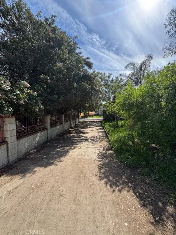 Driveway between front and rear of the home.