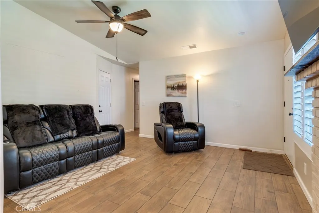 Living Room with Ceiling Fan and Recessed Lights