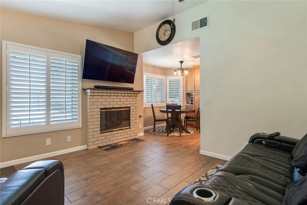 Living Room with Wood-Like Porcelian Tile and Gas Fireplace
