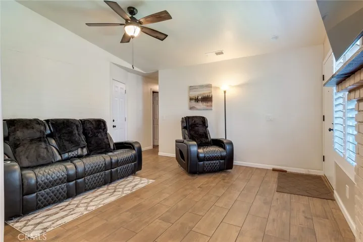 Living Room with Ceiling Fan and Recessed Lights