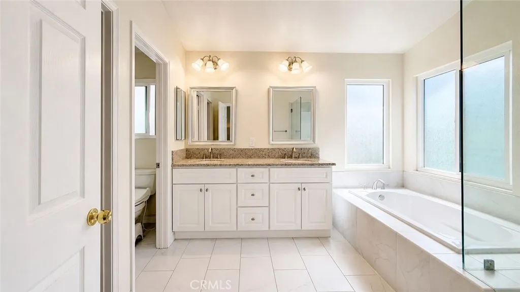 Master Bedroom - Tub, dual sink, individual shower area & walk-in closet