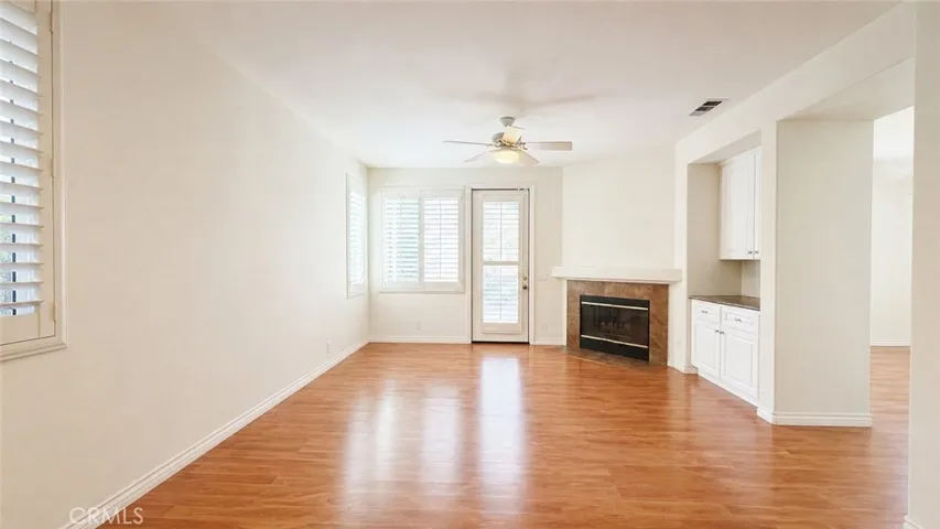Furniture removed digitally - Fireplace & Door to the backyard
