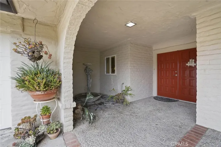 Lovely entry with water feature and covered porch