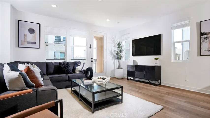 The great room offers Luxury Vinyl Plank Flooring throughout, plus window coverings.