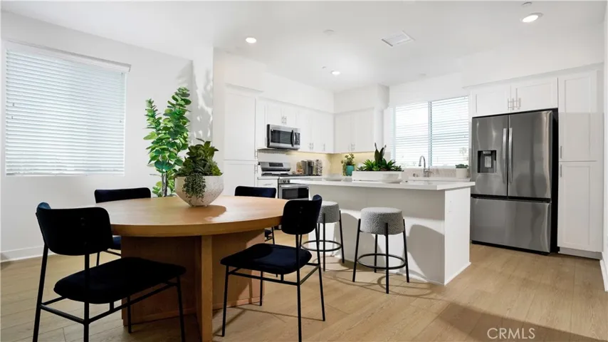 the dining space sits conveniently between the kitchen and living area - keeping everyone connected