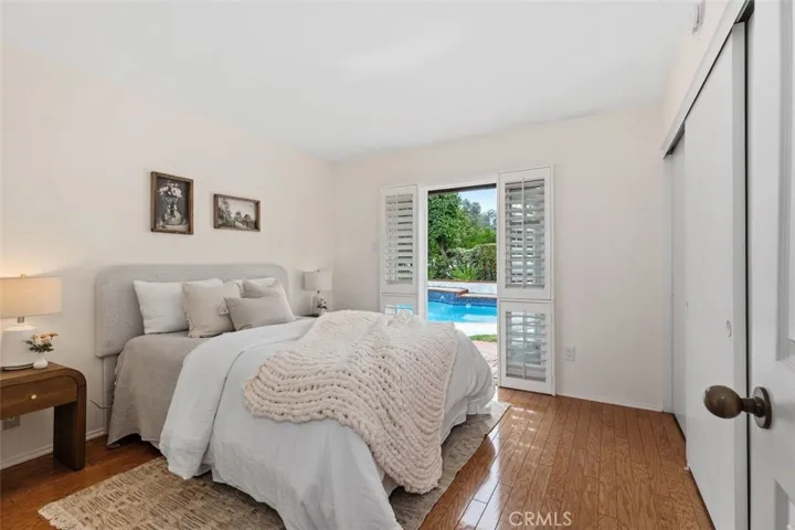 Guest bedroom #2 with a door opening to the pool deck.