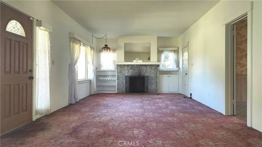 Entrance view of living room with fireplace